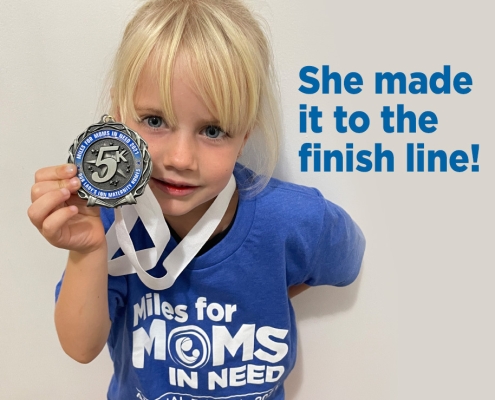 Girl holding medal in hand. Text in image: "She made it to the finish line!"